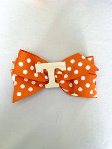 Orange polka dot "T" bow