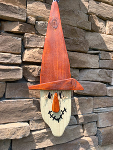 Hanging Scarecrow perfect for Fall front door decor..  Handmade from reclaimed wood.  Suitable for outdoor use.  