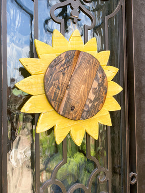 Hanging Yellow Sunflower door decor with rustic center, handmade from reclaimed wood.  Suitable for outdoor use.  